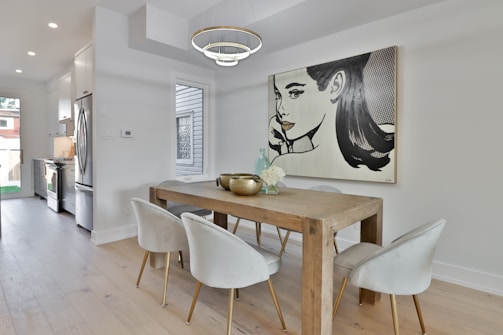 Before and after images of a stylish dining room renovation.