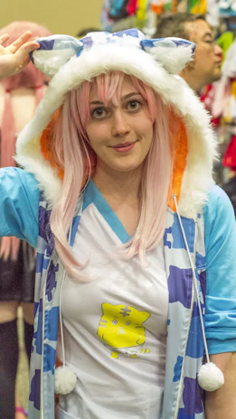 A vibrant photo of a fan proudly wearing a BTS-themed hoodie from Kpop Pulse at a concert.