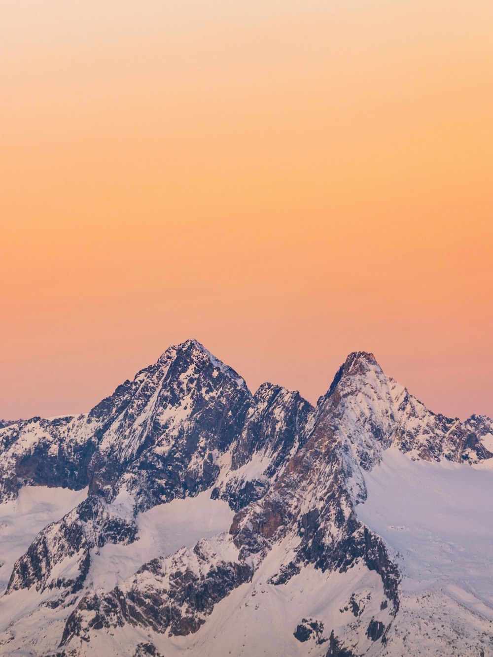 snow covered mountain under blue sky during daytime