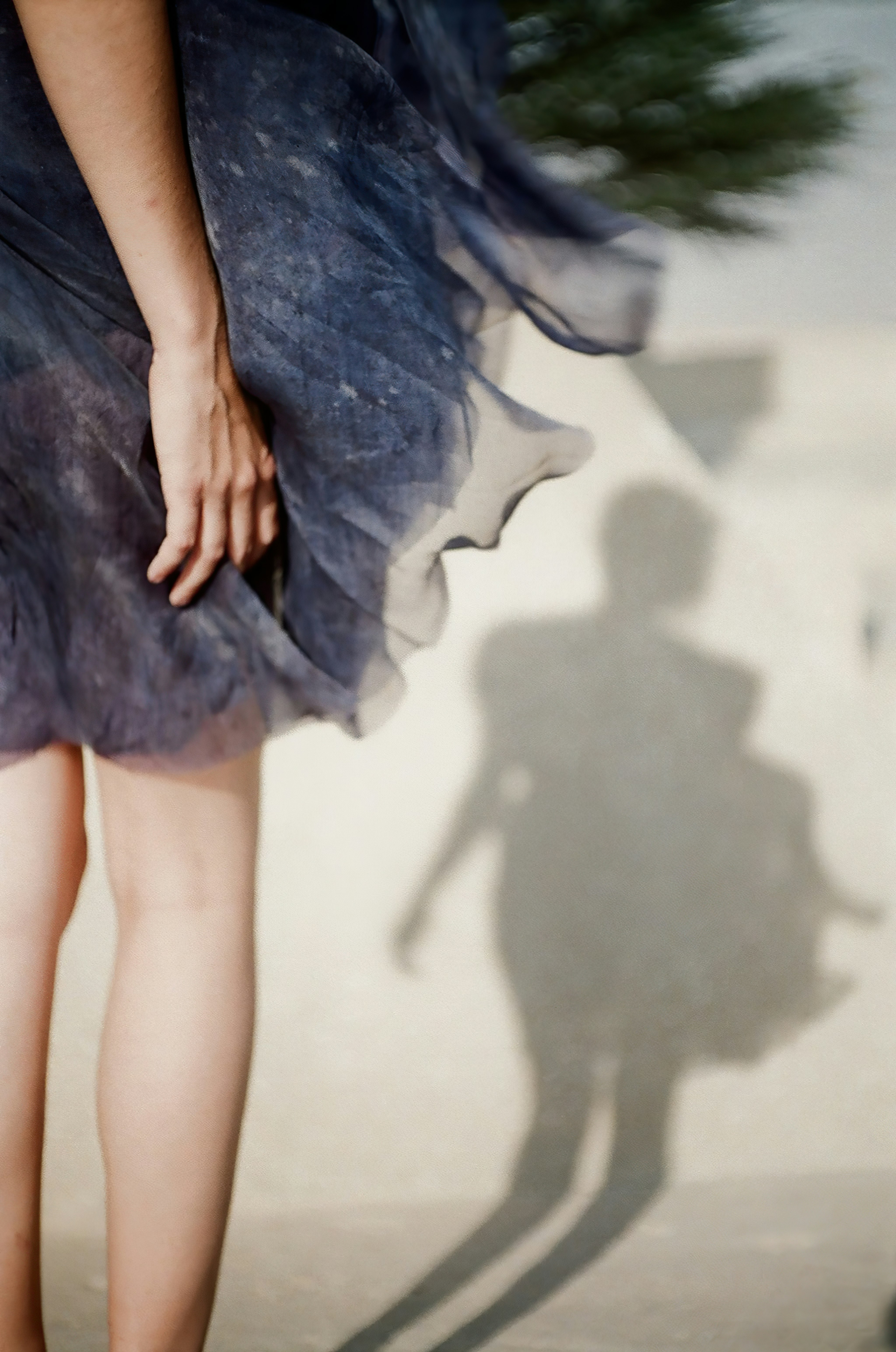 woman in blue dress standing