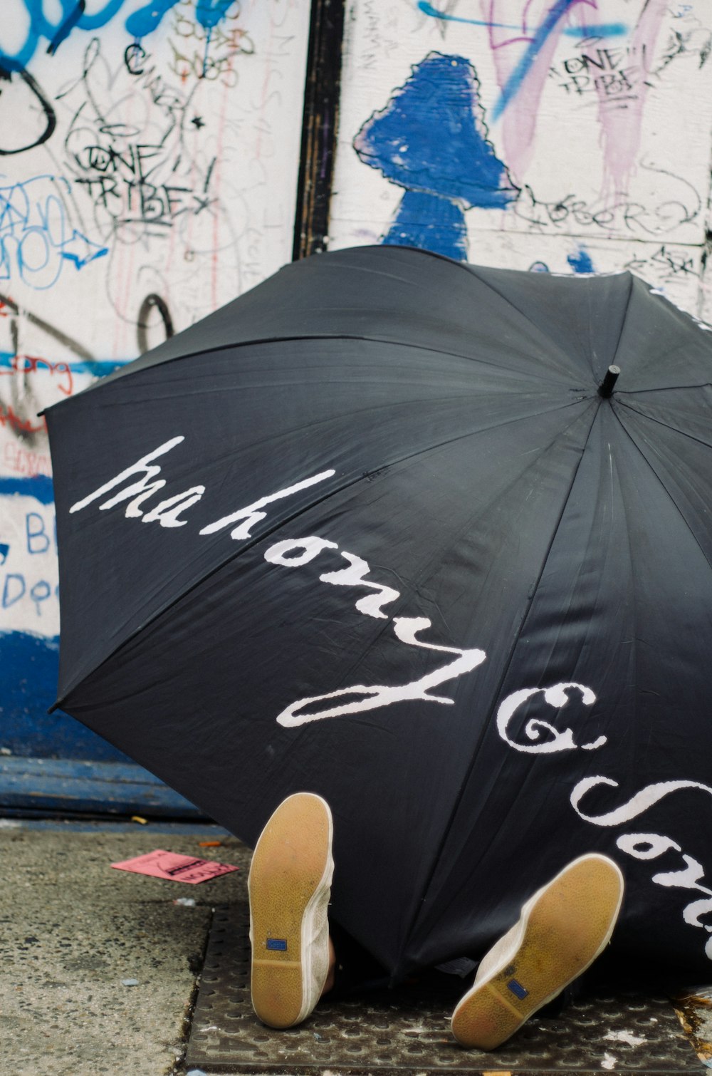 black umbrella on gray concrete floor