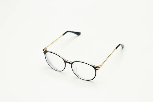 Brown framed eyeglasses on white surface