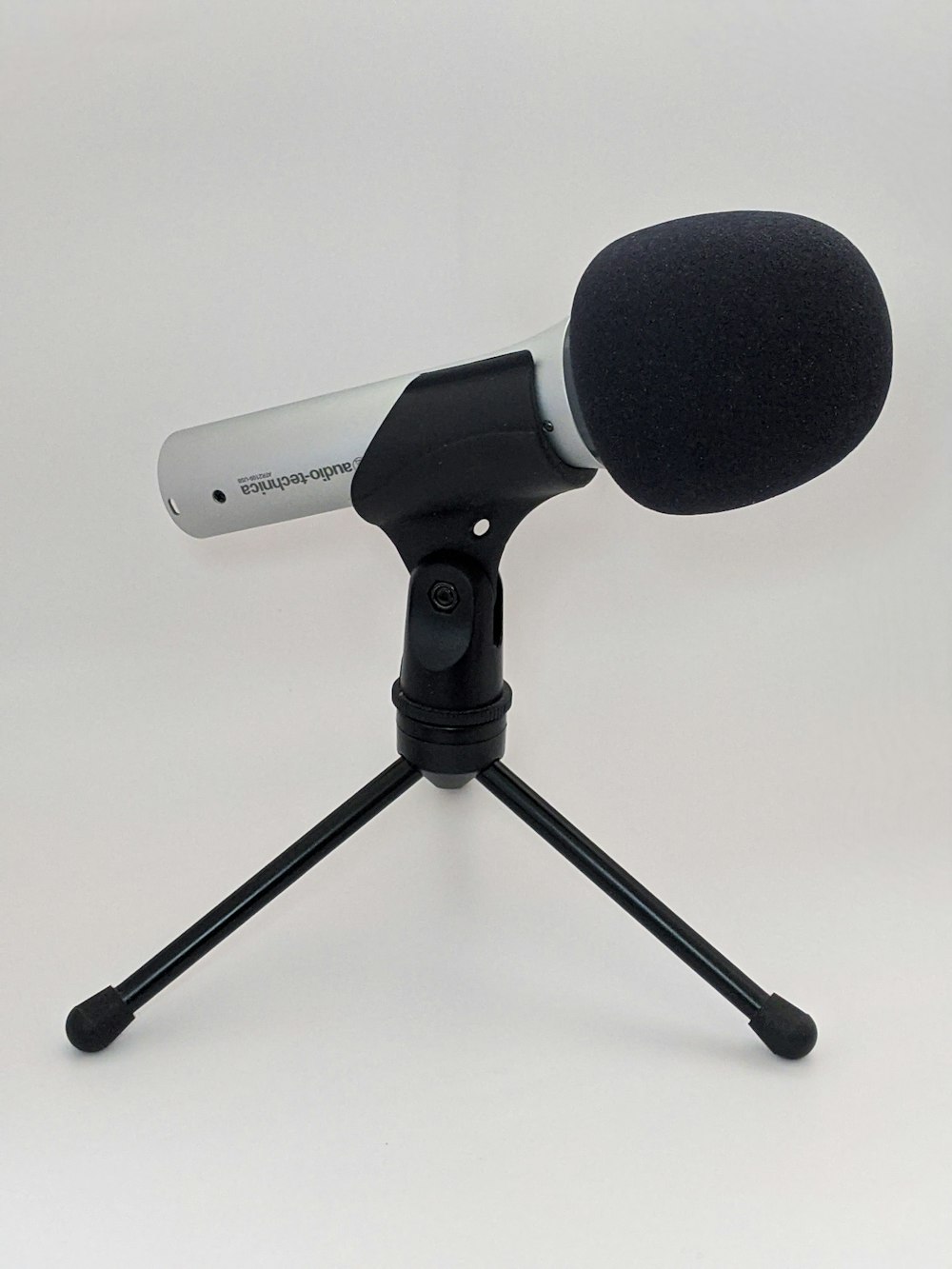 black microphone on white background