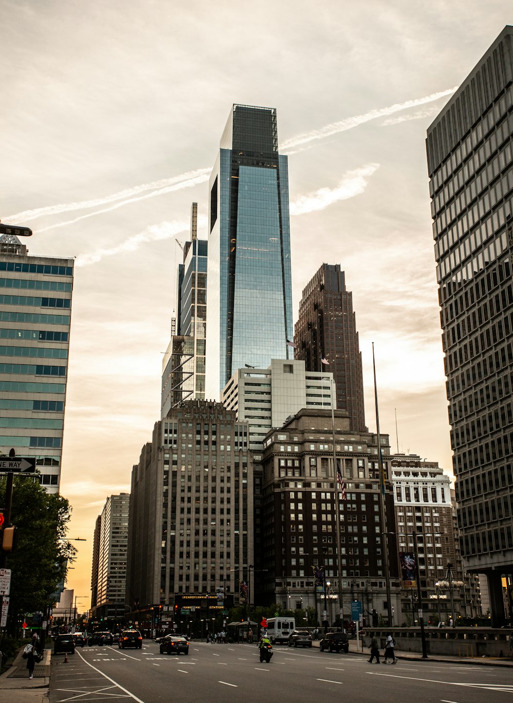 high rise buildings under white clouds during daytime