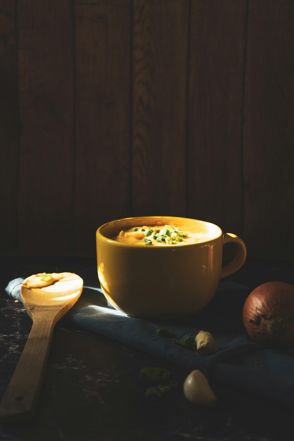 yellow ceramic mug on black table