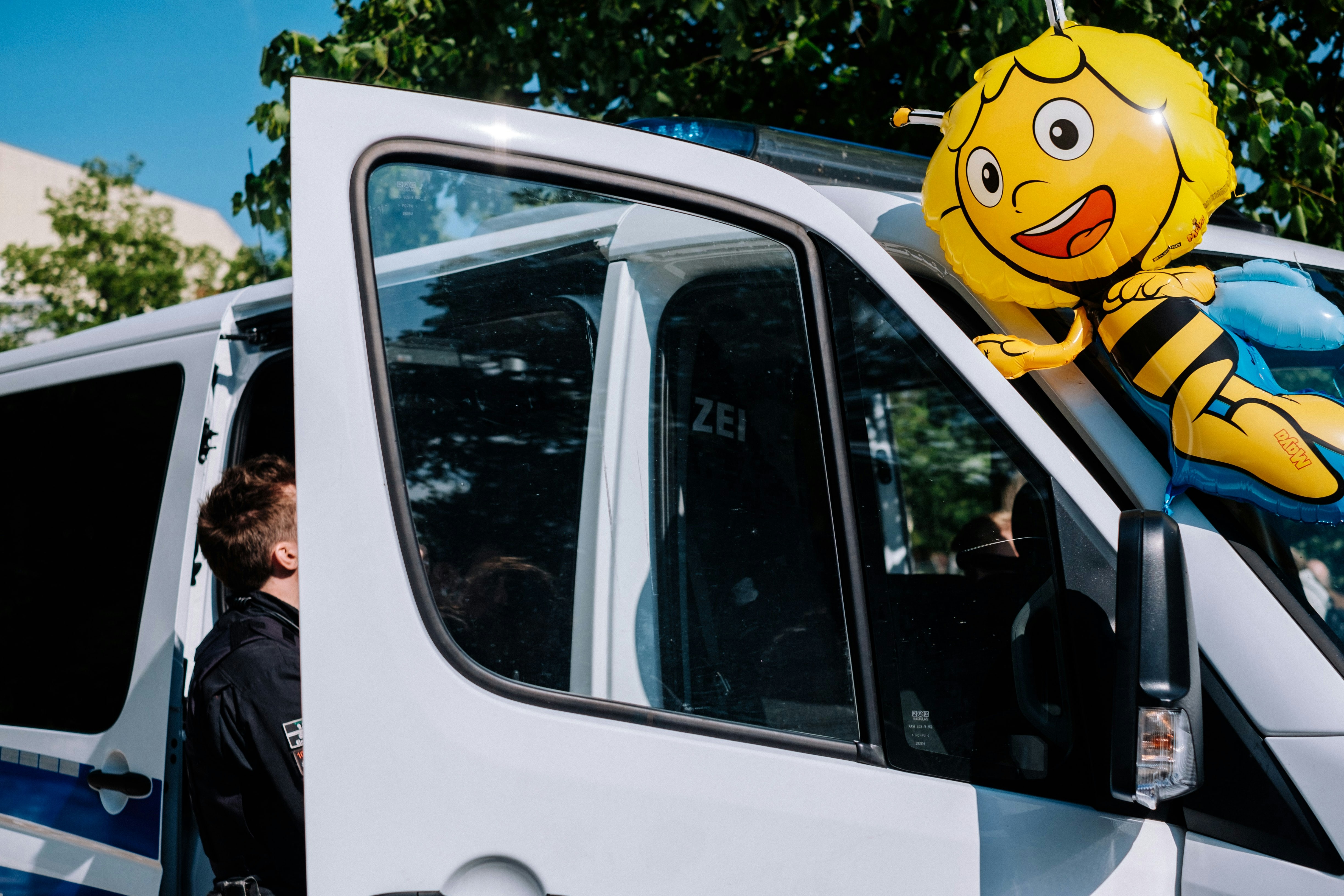 Friendly HVAC technician smiling next to a service van - hvac weirton wv