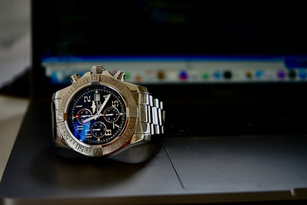 blue and silver chronograph watch