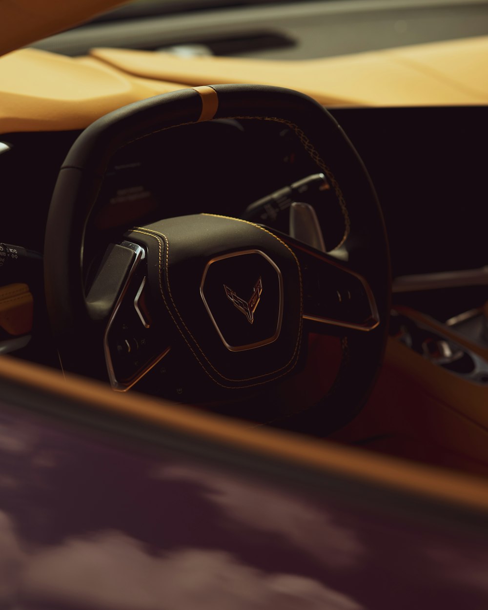 black and yellow car steering wheel