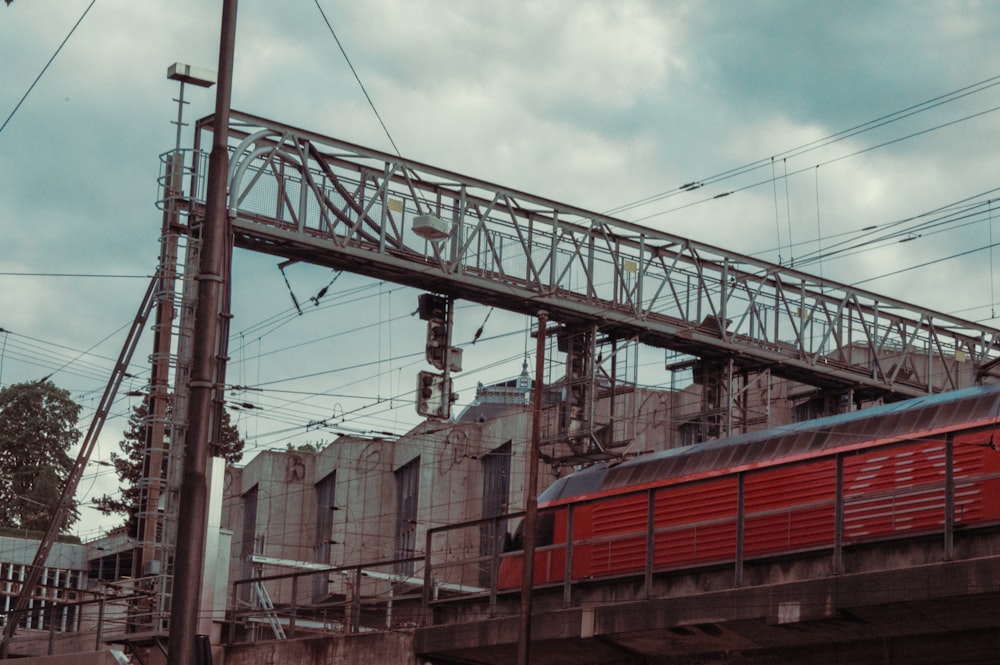 red and white train on rail tracks during daytime