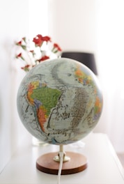 white and blue desk globe