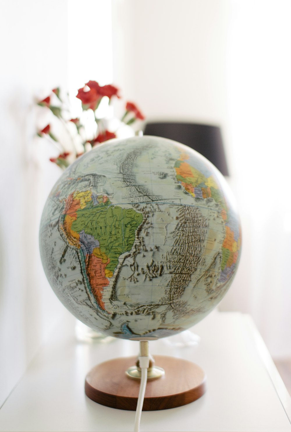 white and blue desk globe