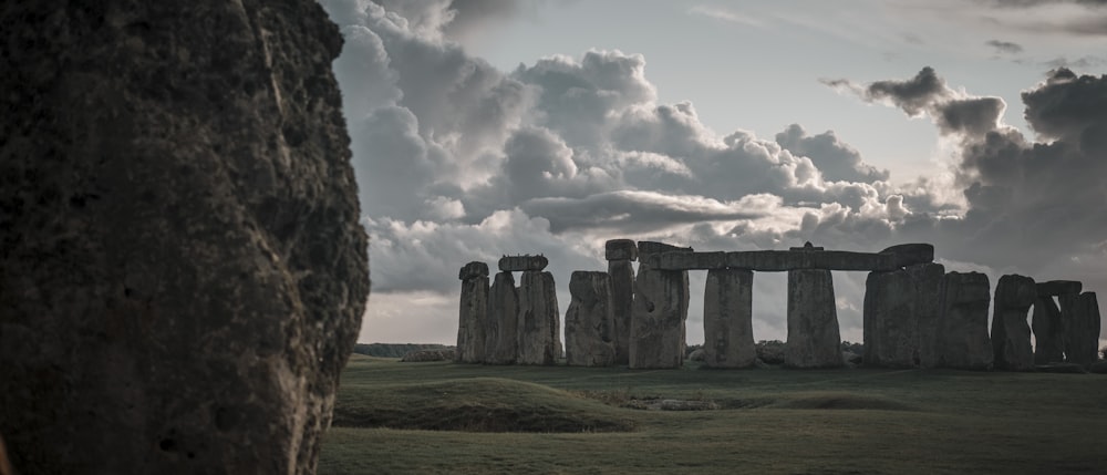 gray rock formation under white clouds during daytime