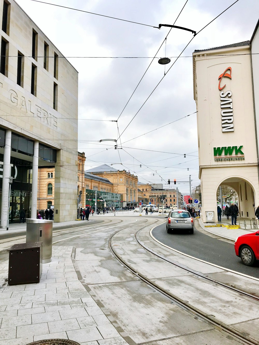 cars parked beside the road near the building during daytime