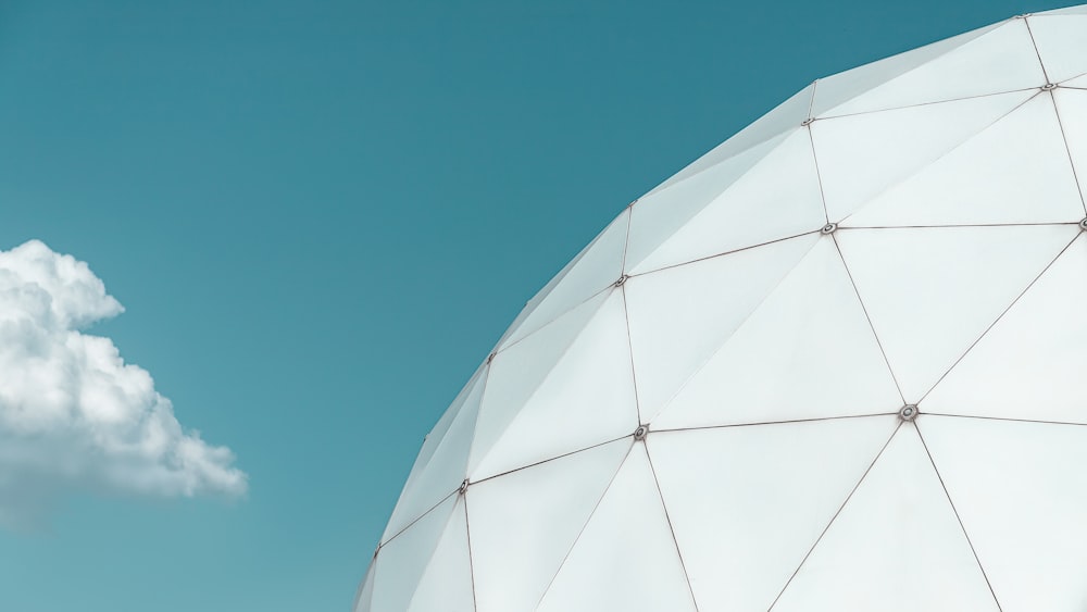 white round building under blue sky during daytime