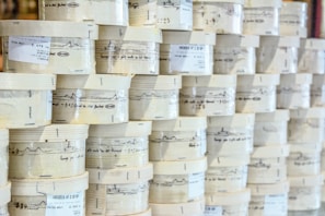 Rows of sealed packaging boxes labeled with size grades ready for export