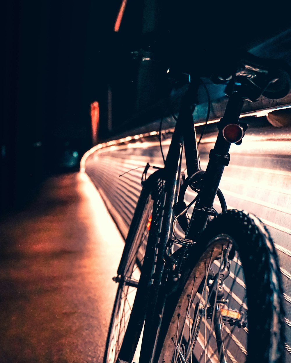 black bicycle on road during night time