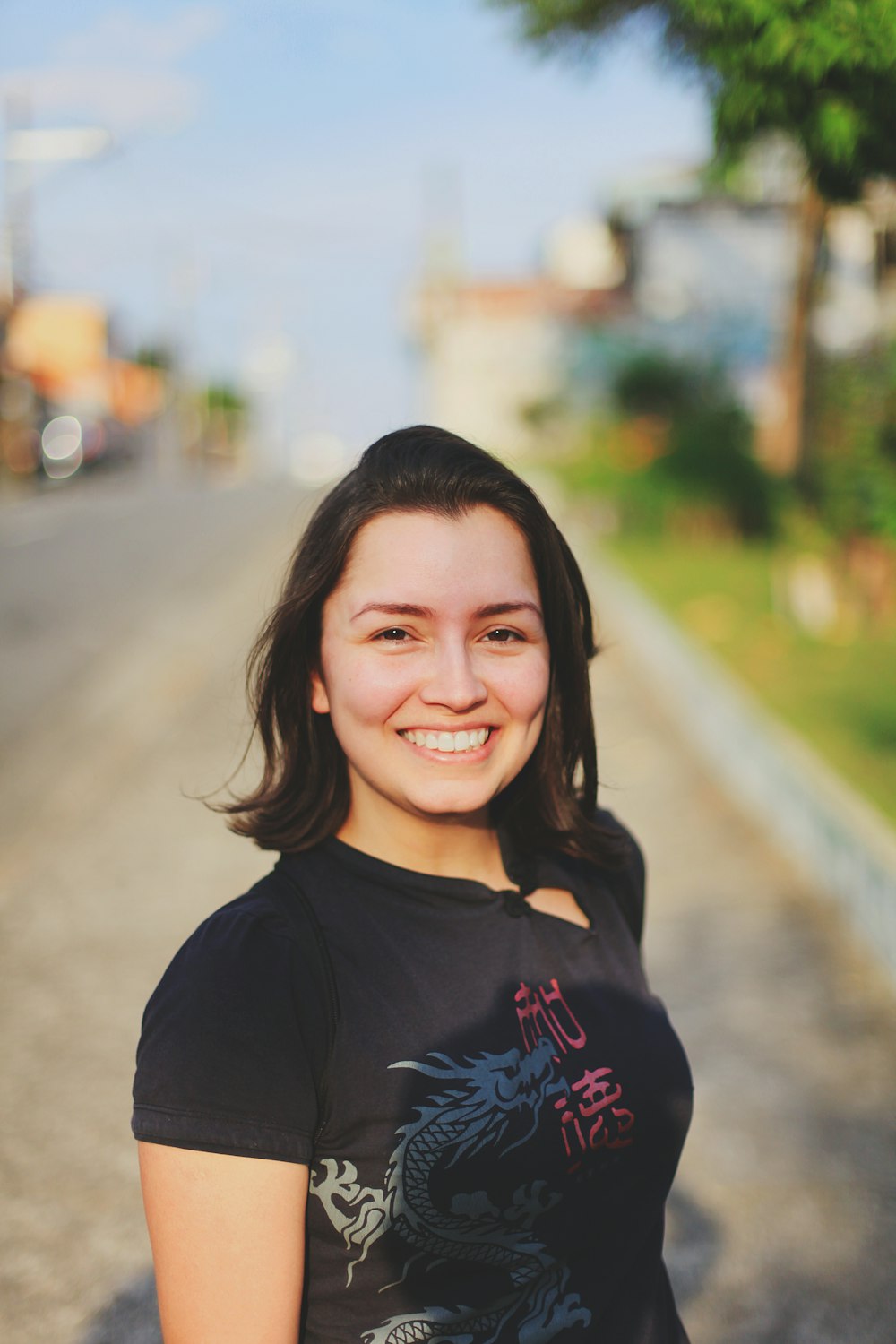 smiling woman in black crew neck shirt