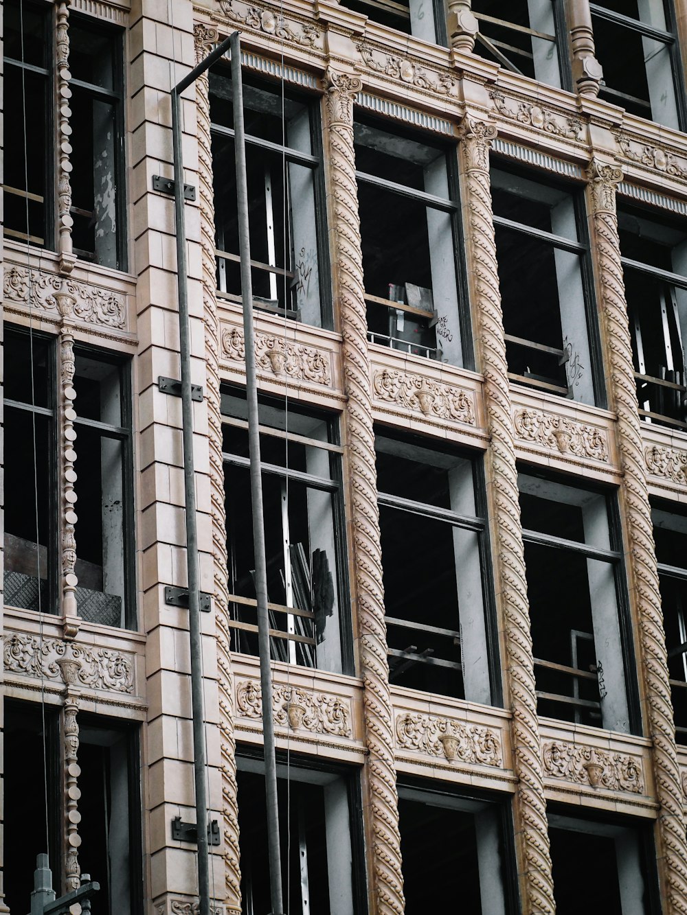 brown concrete building with glass windows