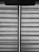 Horizontal blinds with a fabric texture are partially drawn, allowing a vertical sliver of light to pass through. A pull cord hangs from the upper portion of the blinds.