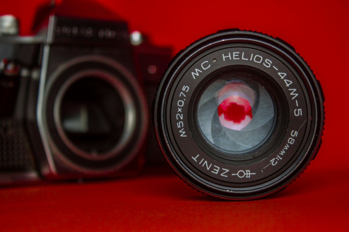Close-up of a camera with a red background, unrelated to team meal ideas for sports teams.