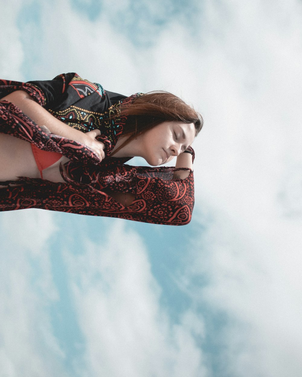 woman in black and white floral long sleeve dress