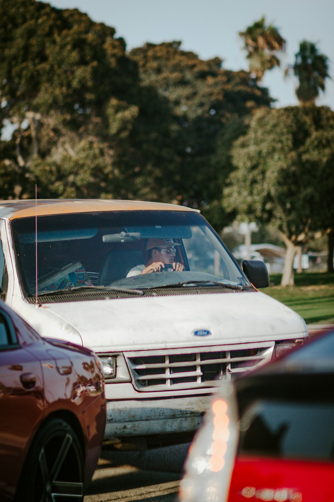 white chevrolet car on road during daytime