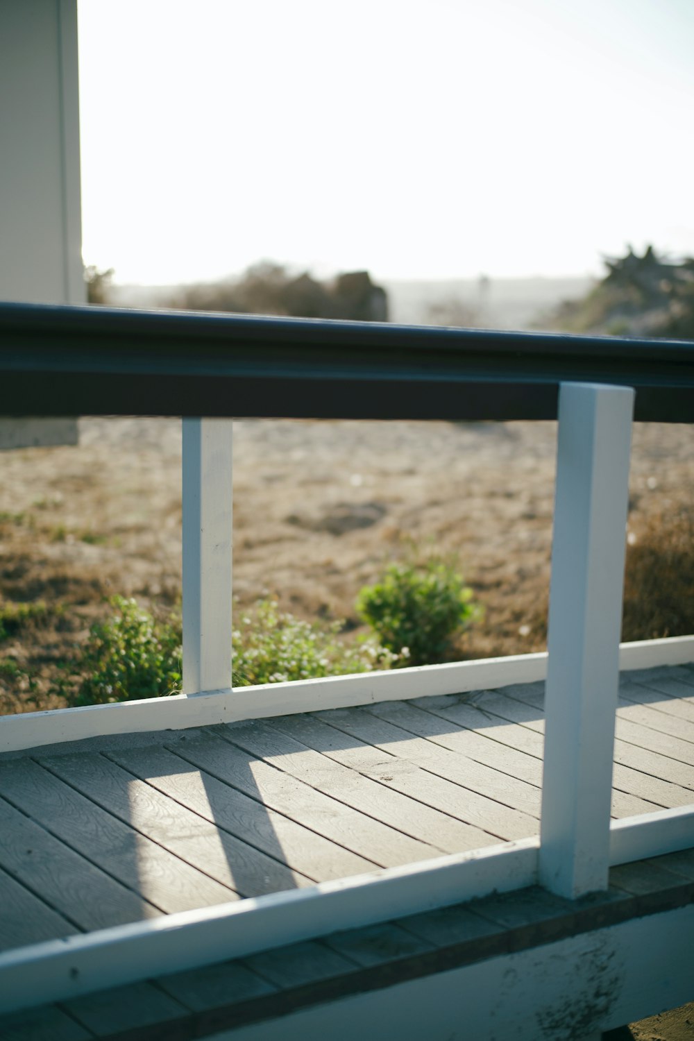 black metal railings near green grass field during daytime