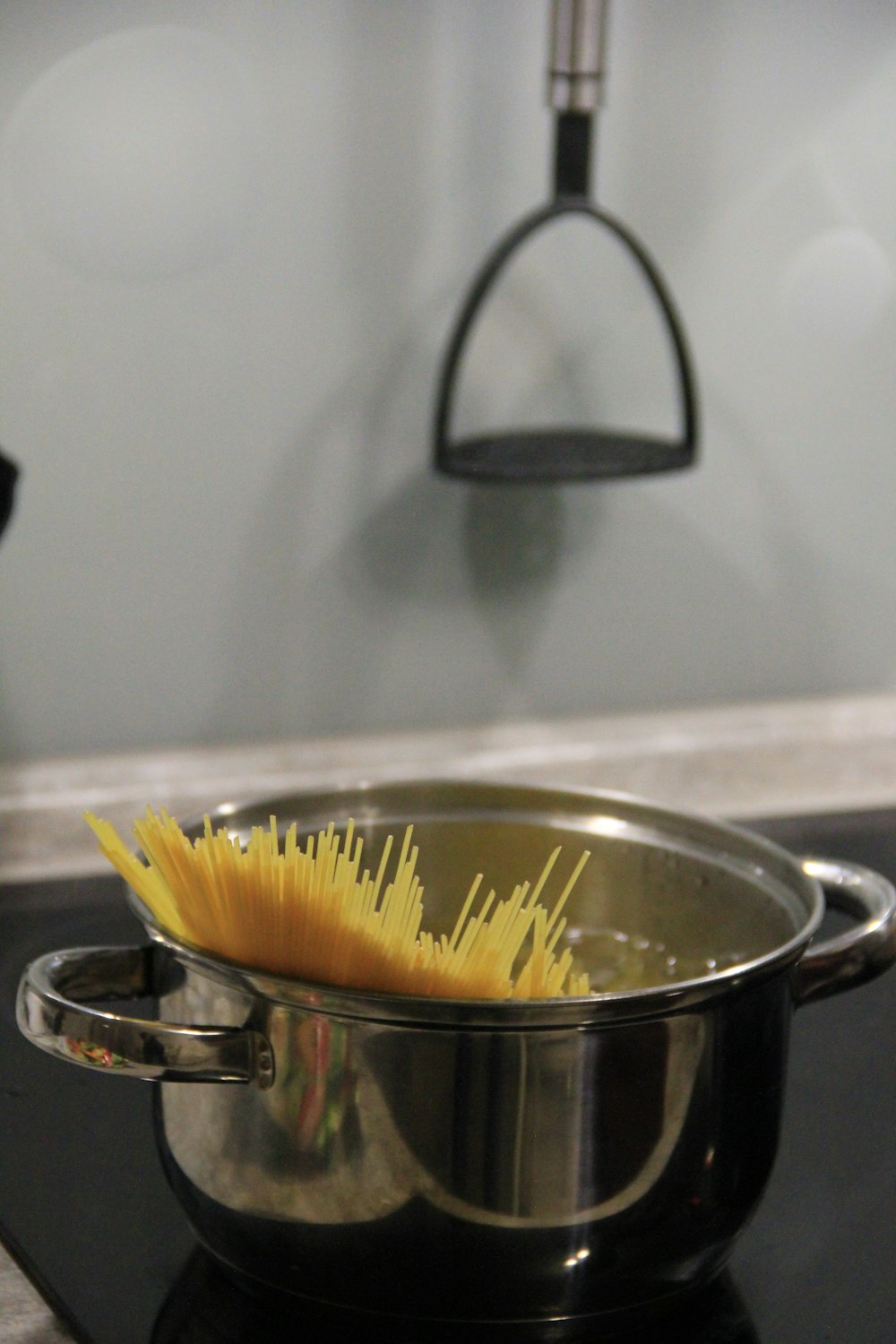 stainless steel cooking pot with yellow pasta
