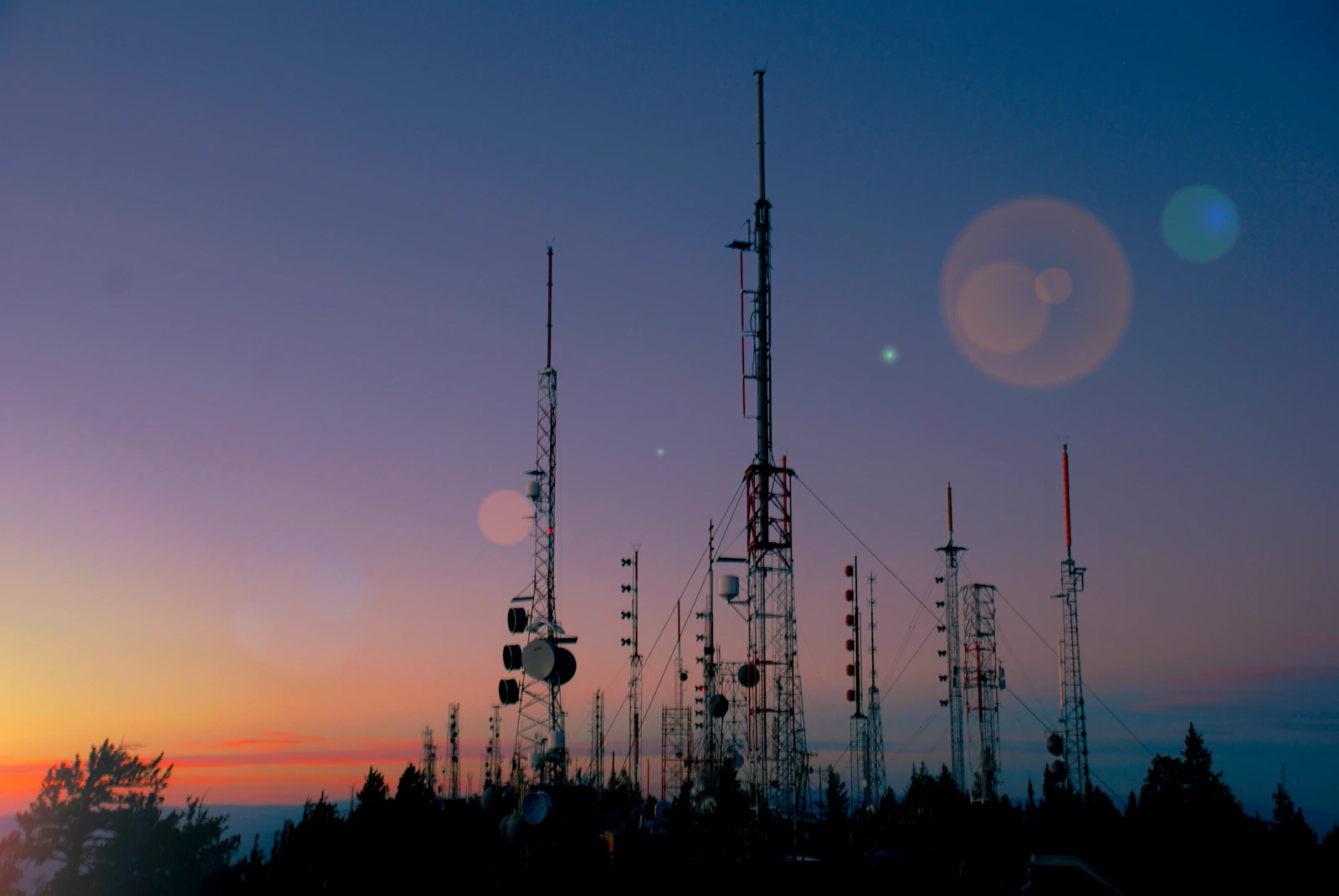 Silhouette of a broadcast tower at sunset