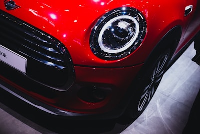 Close-up of a shiny used car being inspected before export