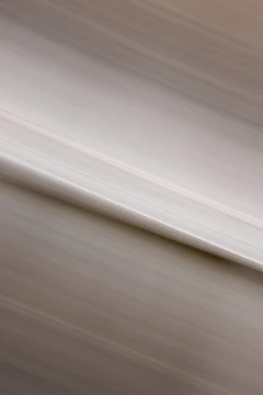 Soft taupe abstract waves blending into a warm beige background.