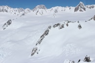 A picturesque view of a mountain range covered in snow.