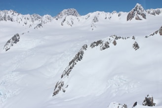 A picturesque view of a mountain range covered in snow.