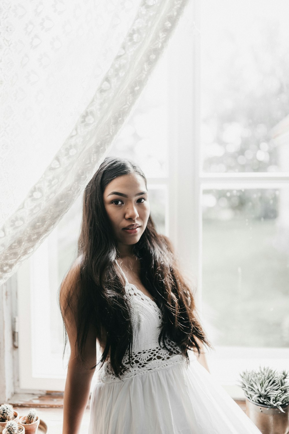 woman in white and black floral dress