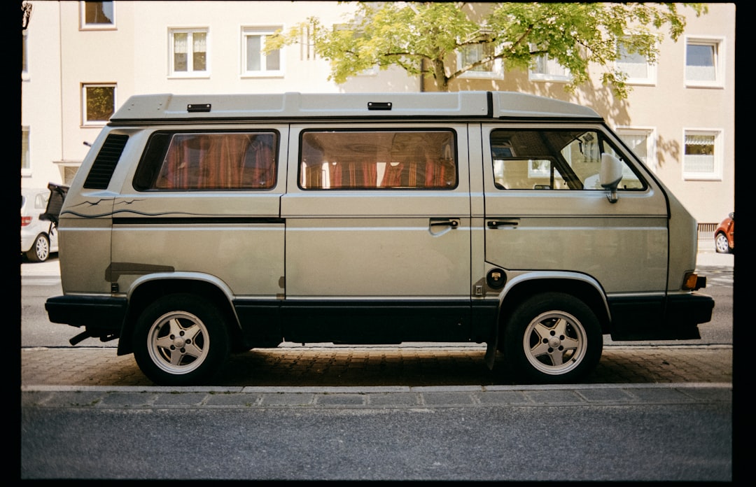 white van on gray asphalt road during daytime