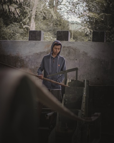 Raul Alejandro Padilla Orozco enjoying a quiet moment outdoors reflecting.