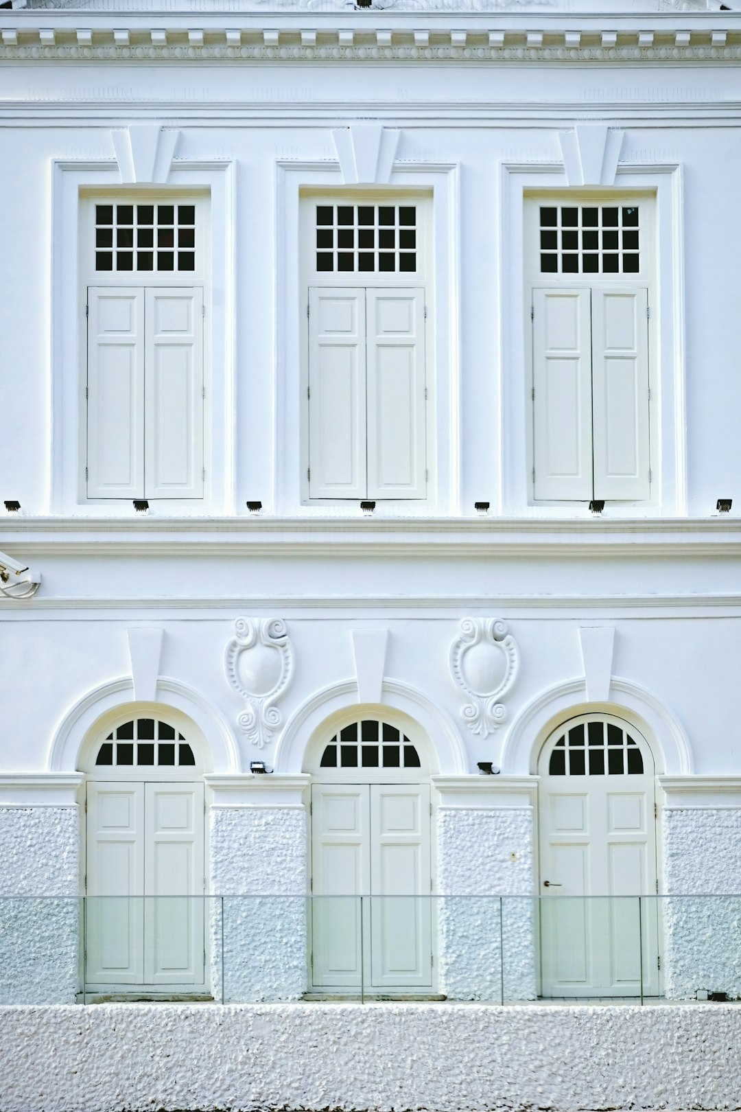 white concrete building with windows