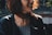 woman in black jacket with brown and black floral tattoo on her left shoulder