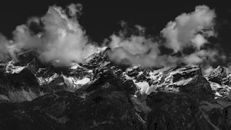 grayscale photo of mountain covered by snow