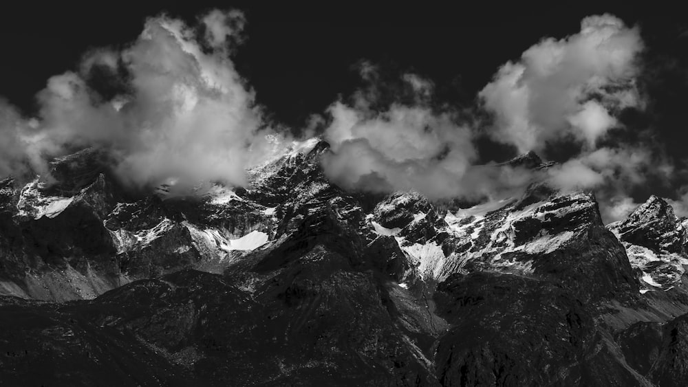 grayscale photo of mountain covered by snow