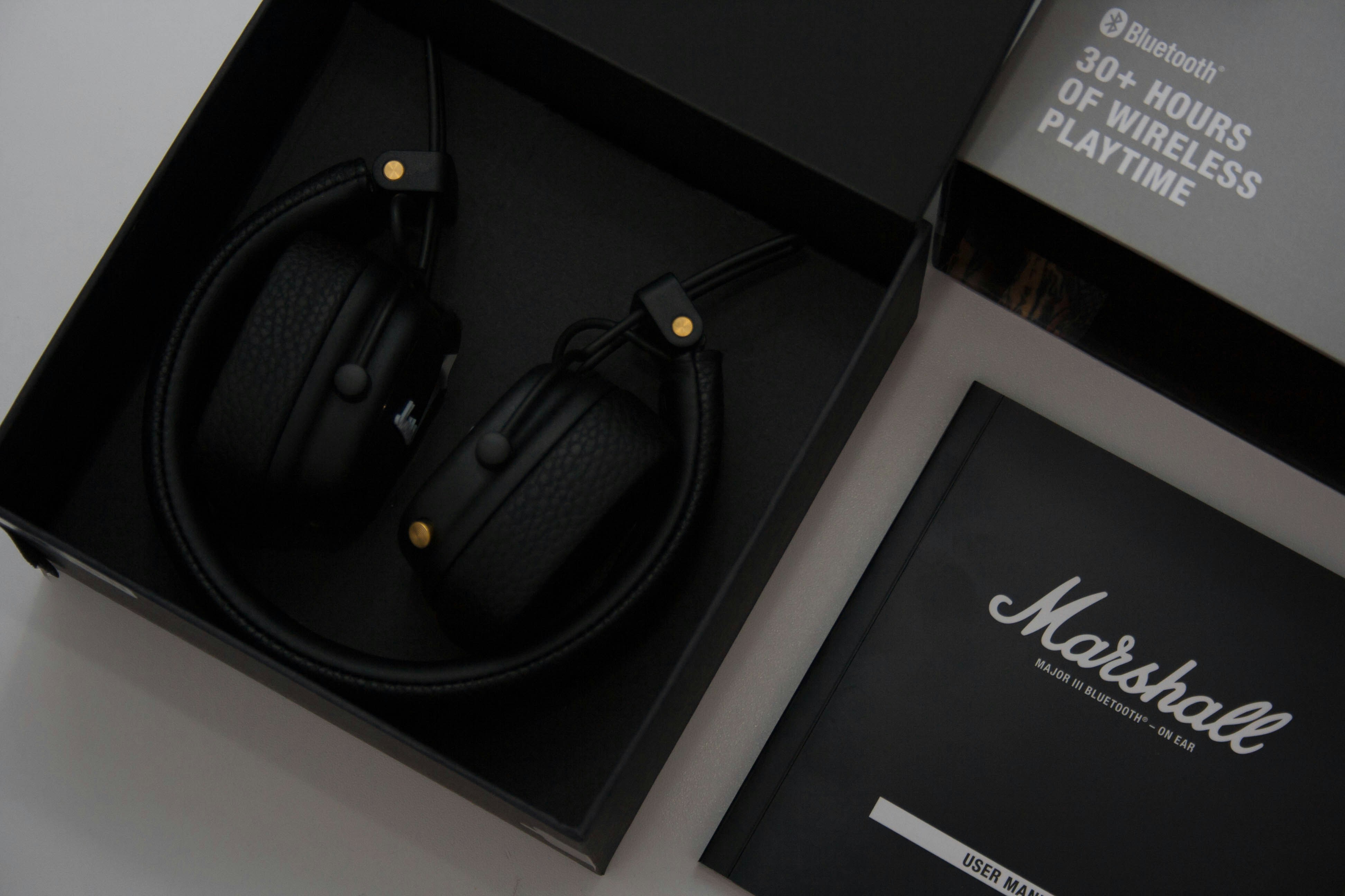 black wireless headphones on black box
