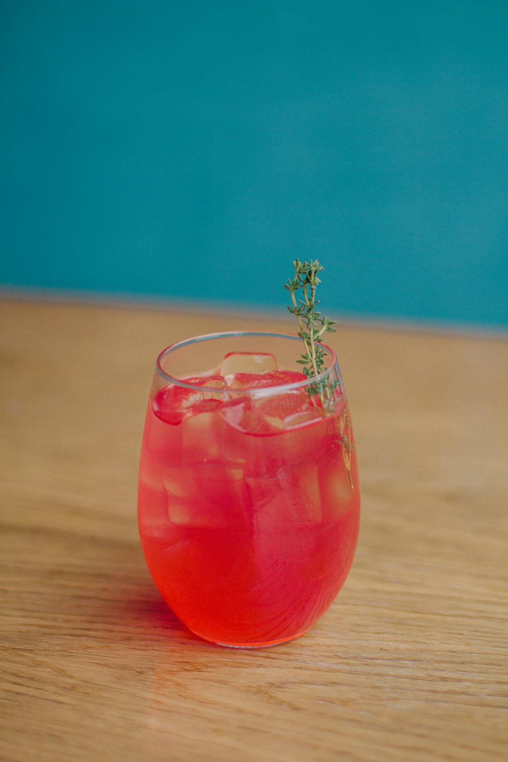 clear drinking glass with red liquid