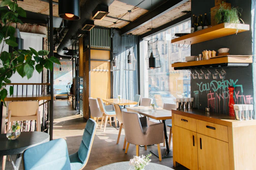 Cozy modern cafe interior with warm lighting and industrial design elements.
