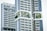 Modern high-rise residential buildings with a unique architectural design featuring prominent balconies and integrated greenery. The structures have a geometric pattern with large windows and white, sleek facades.