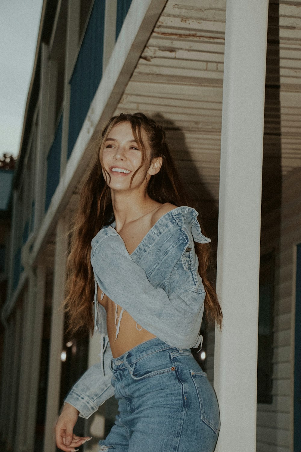 woman in blue denim jacket smiling