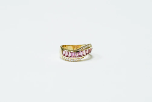 Final inspection of an elegant ring, showcasing the blend of classic and modern design.