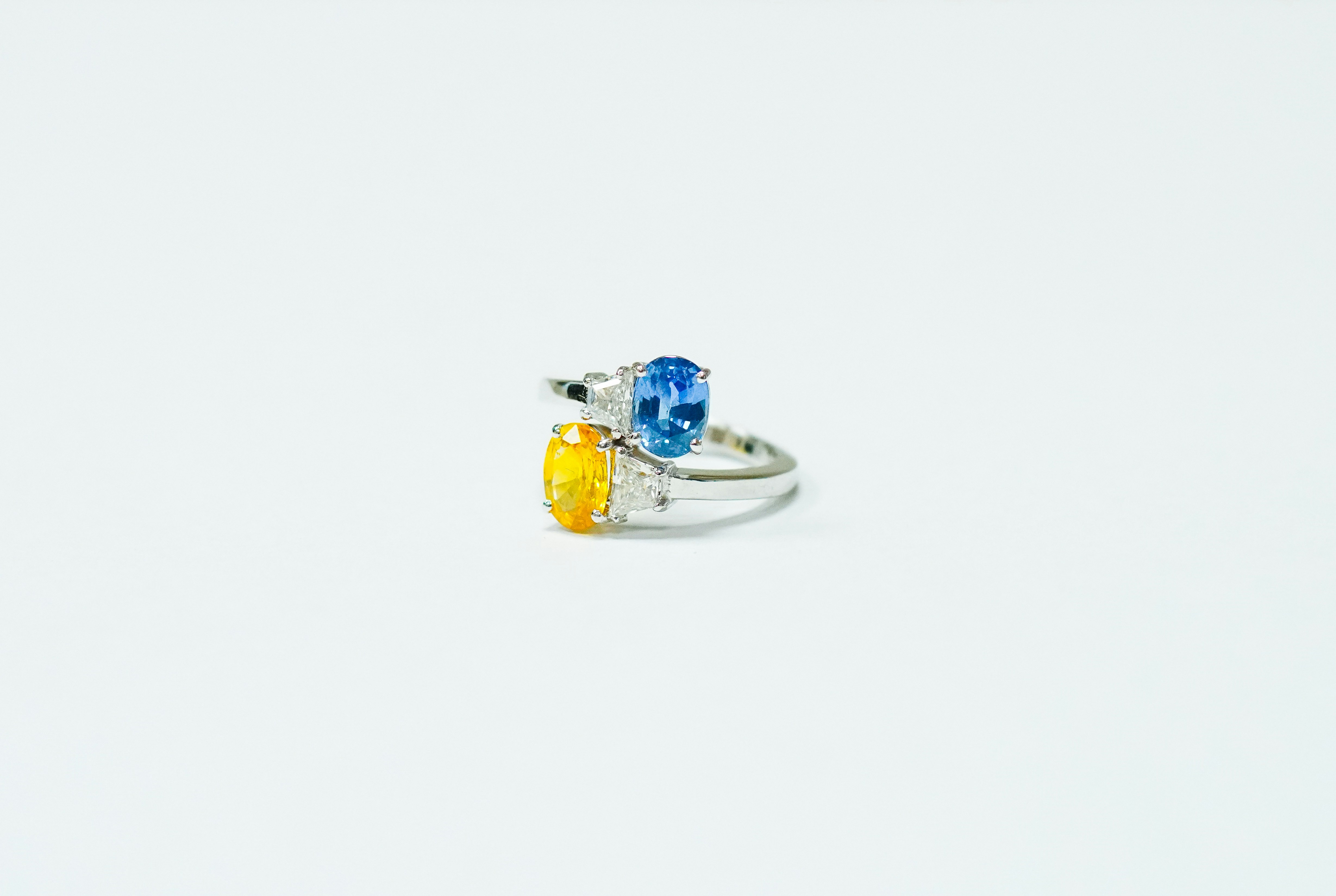 blue and silver ring on white surface