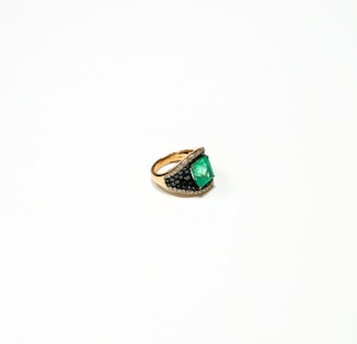 silver and green stone ring