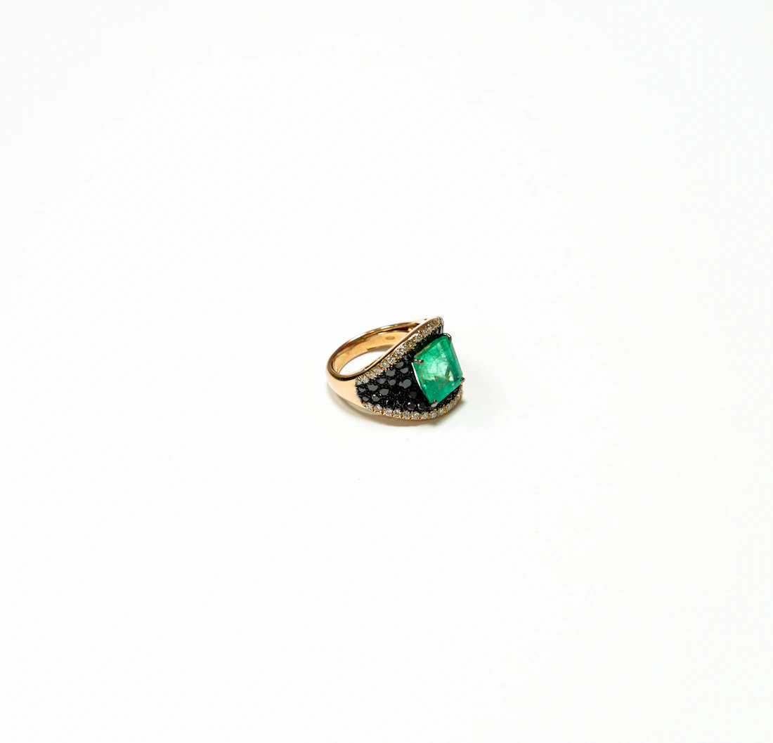 Emerald-cut emerald ring set with diamond shoulders