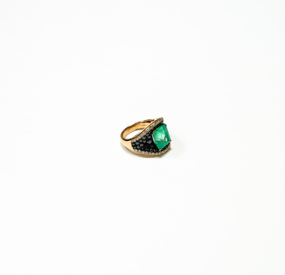 silver and green stone ring